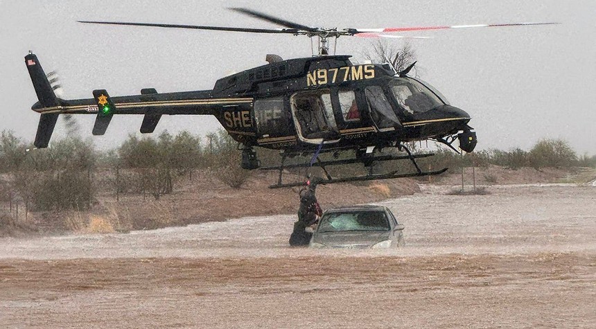 Arizona Sheriff's Office Executes Helicopter Rescue of Elderly Couple Trapped in Flood Waters